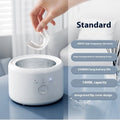 White ultrasonic tooth socket cleaning machine with 300ml tank, third gear timing, and 3-step thermostat on countertop
