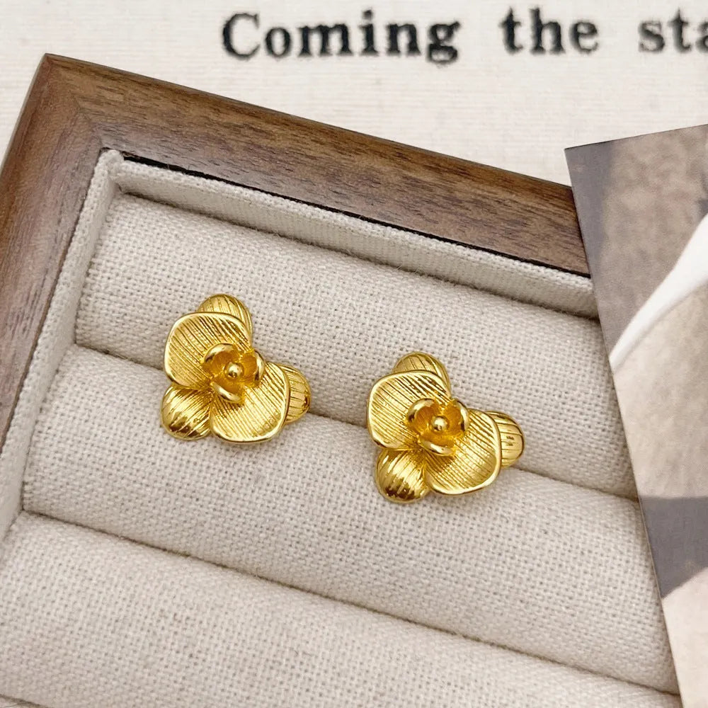 Retro flower earrings with petal detailing in gold or silver electroplated finish on copper