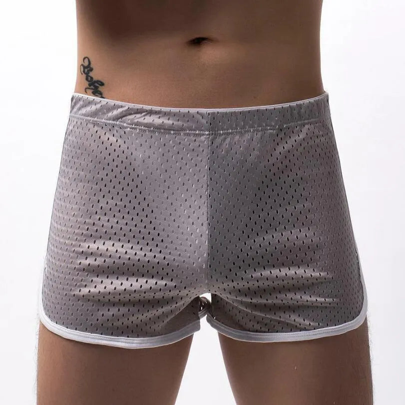 Men's cotton boxer shorts in multiple colours on a mid-waist fit model