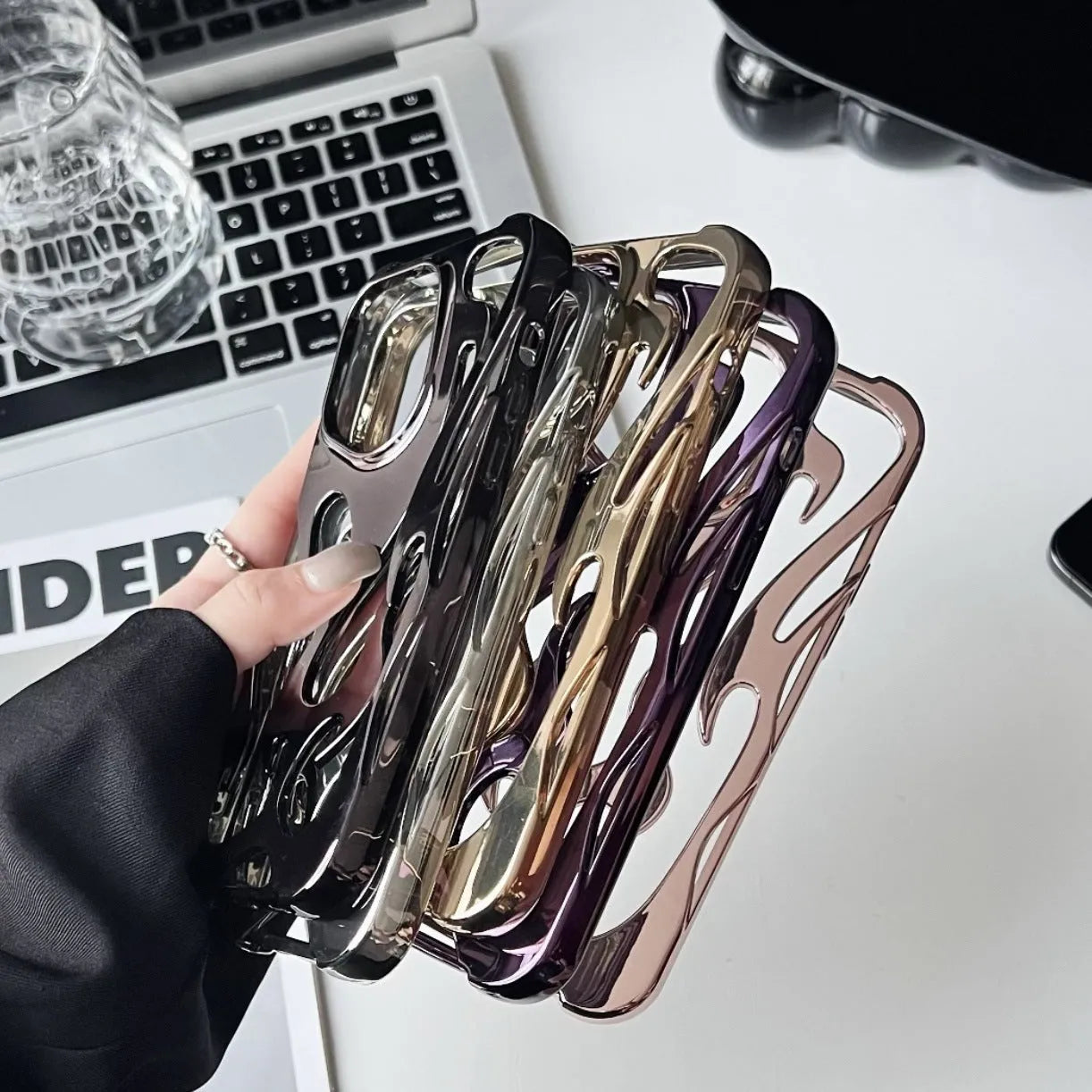 Electroplated hollow flame pattern iPhone case in silver with TPU soft shell construction