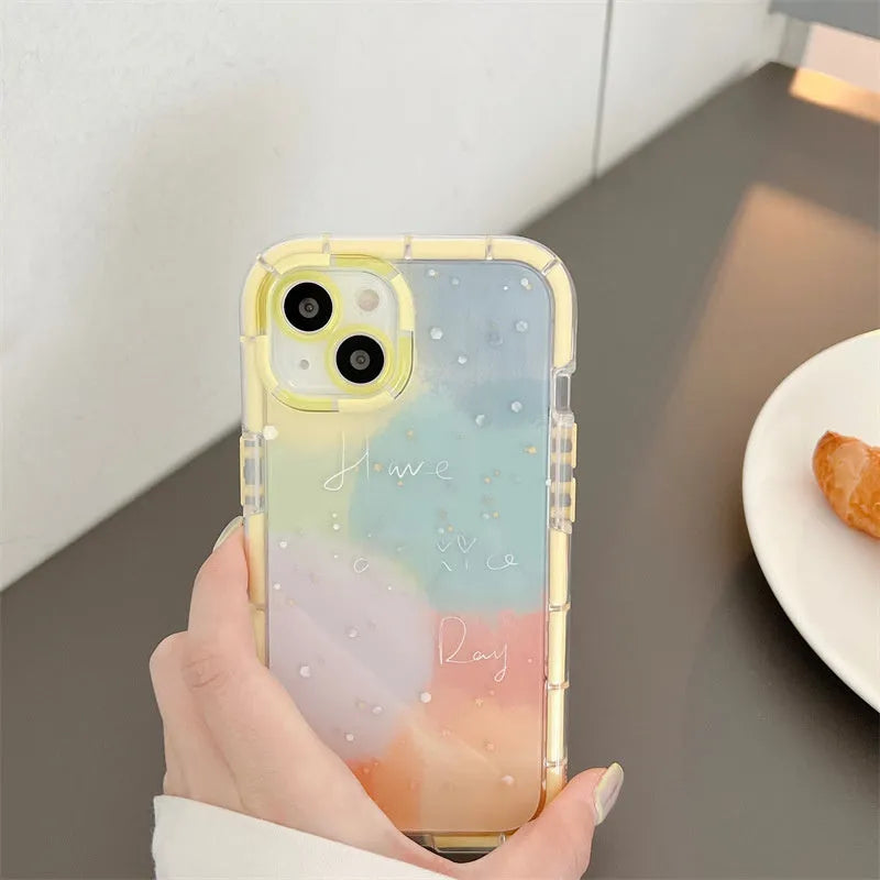 Minimalist yellow-edged silicone phone case for iPhone 14 and other models on a table.