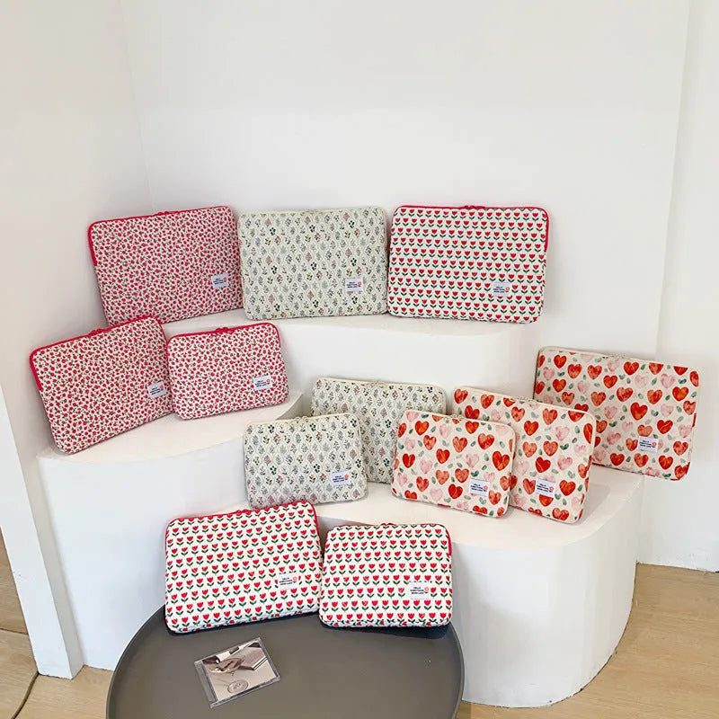 Women's printed cloth laptop bag with floral pattern showing anti-shock protection and storage compartments