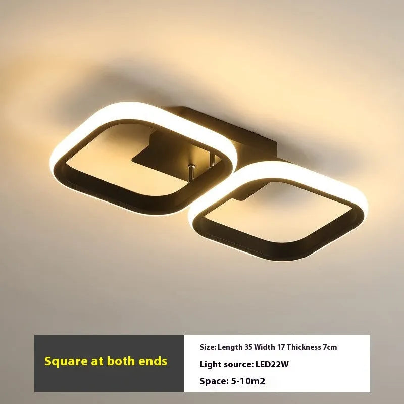 Modern simplicity hallway LED ceiling light in black with three round shapes over a corridor