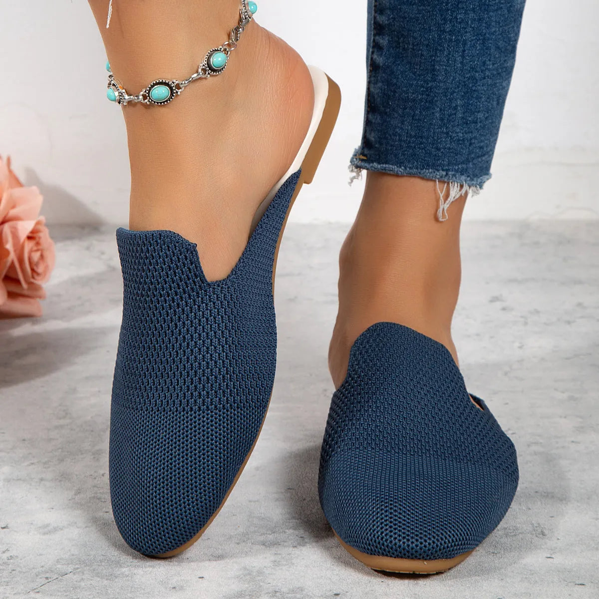 Mesh sandals in apricot, blue, and green colours showing cloth upper and flat rubber sole.
