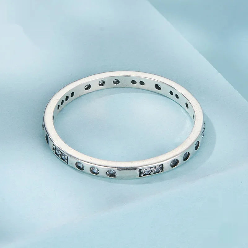 Silver alloy ring with oxidised black finish showing Moss Password I Love You design detail on band.