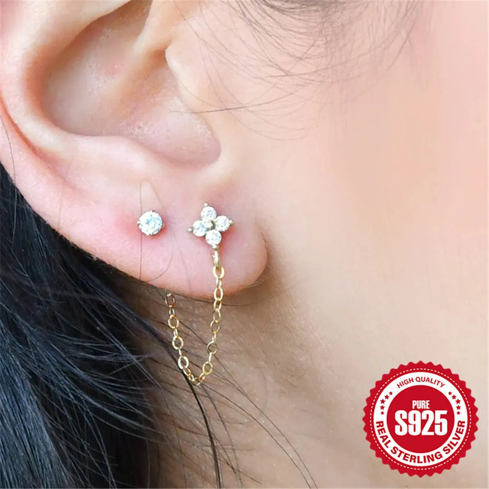 S925 sterling silver geometric ear clip studs with a diamond flower and tassel chain design in a gold electroplated finish.