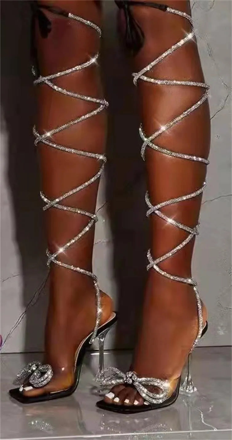 Plus size women's black strappy sandals with rhinestone Roman straps and a square toe
