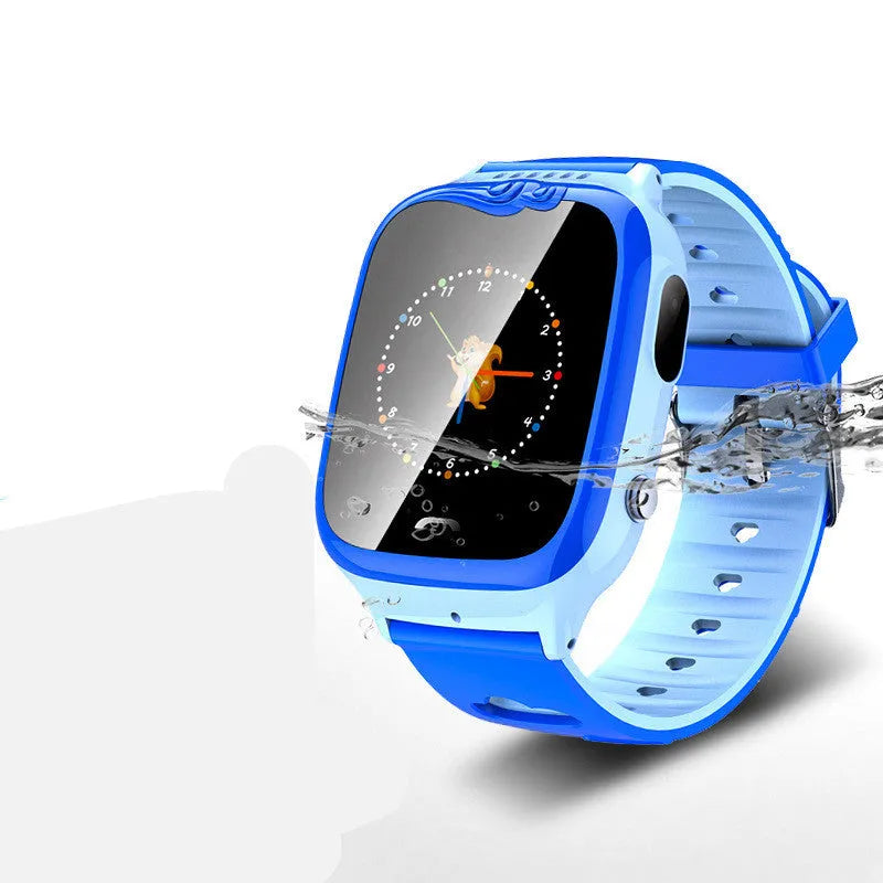 Blue children's smartwatch phone with touchscreen showing time, on a silicone wristband.