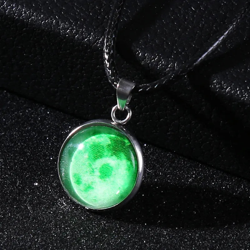 Luminous constellation pendant necklace with adjustable chain on a plain background.