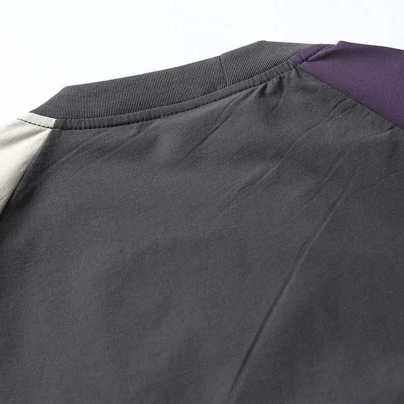 Dark grey loose fit t-shirt with contrast colour raglan short sleeves.
