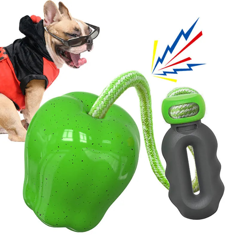 Green apple-shaped plastic dog chew toy with food slot and stem details