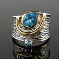 Blue zircon Chinese style women's ring with drop shape and rhinestone detailing on alloy band