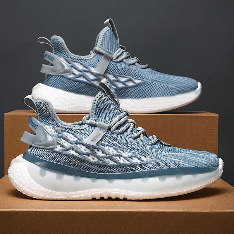 Men's white low-top lace-up sneakers with a woven mesh upper and flat rubber platform sole