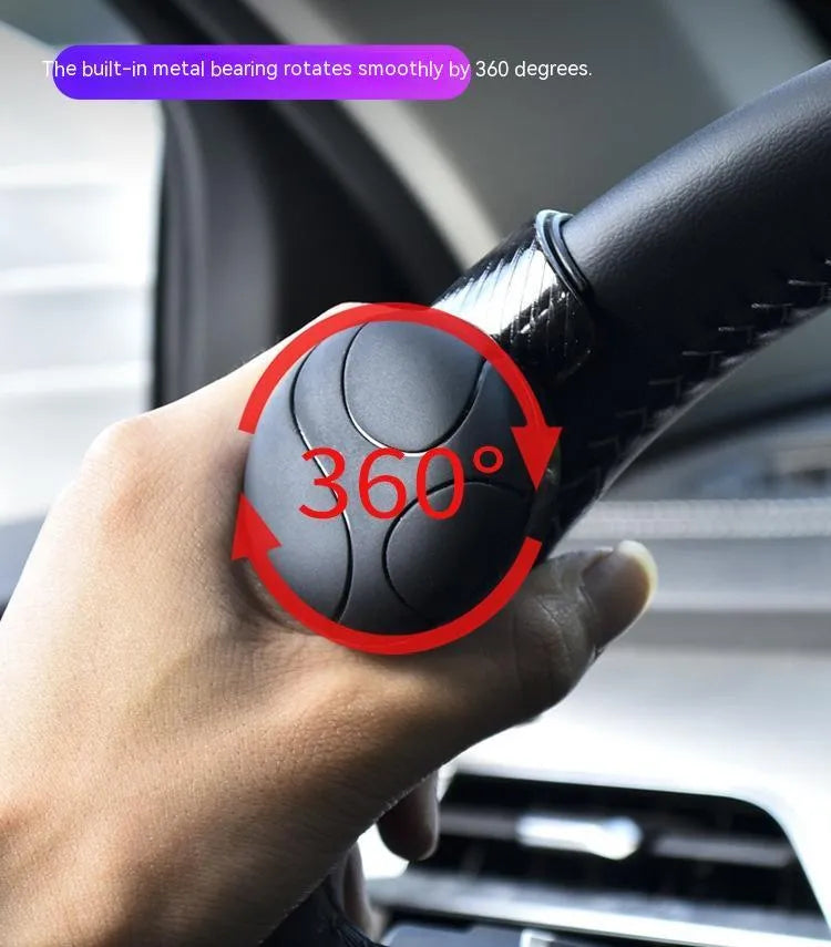 Black silicone steering wheel assist ball with metal bearing for single hand driving