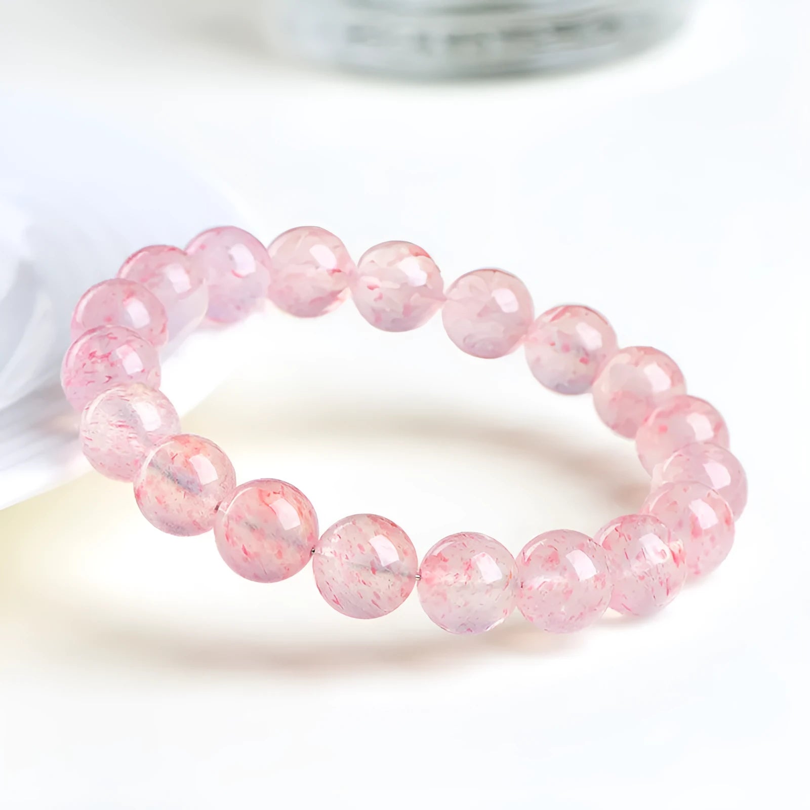 Strawberry quartz crystal bracelet with round 10mm beads on stretch cord