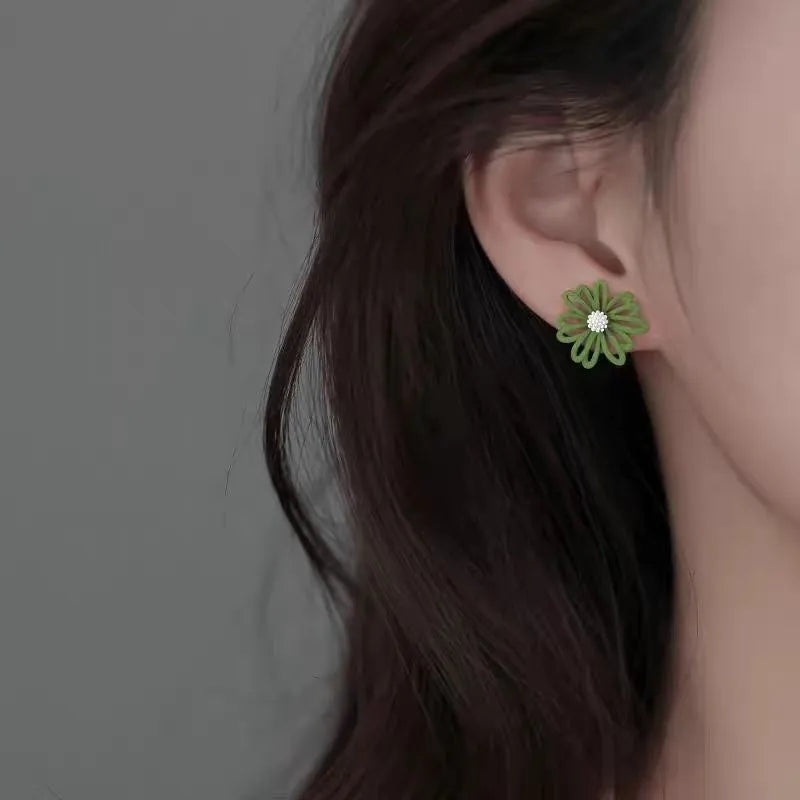 Women's alloy flower stud earrings in blue orange, white green, and yellow white two-tone colour combinations