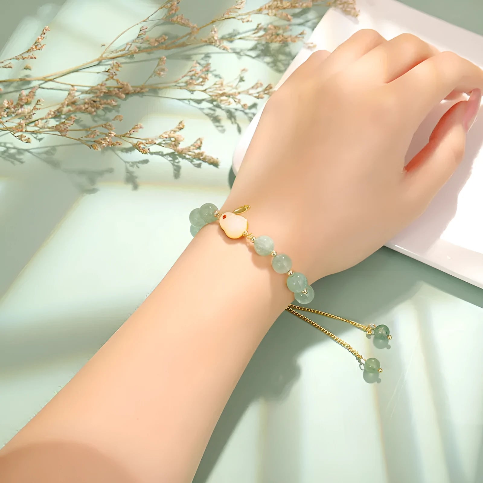 Rabbit charm bracelet with green aventurine or strawberry quartz stones on gold-plated copper