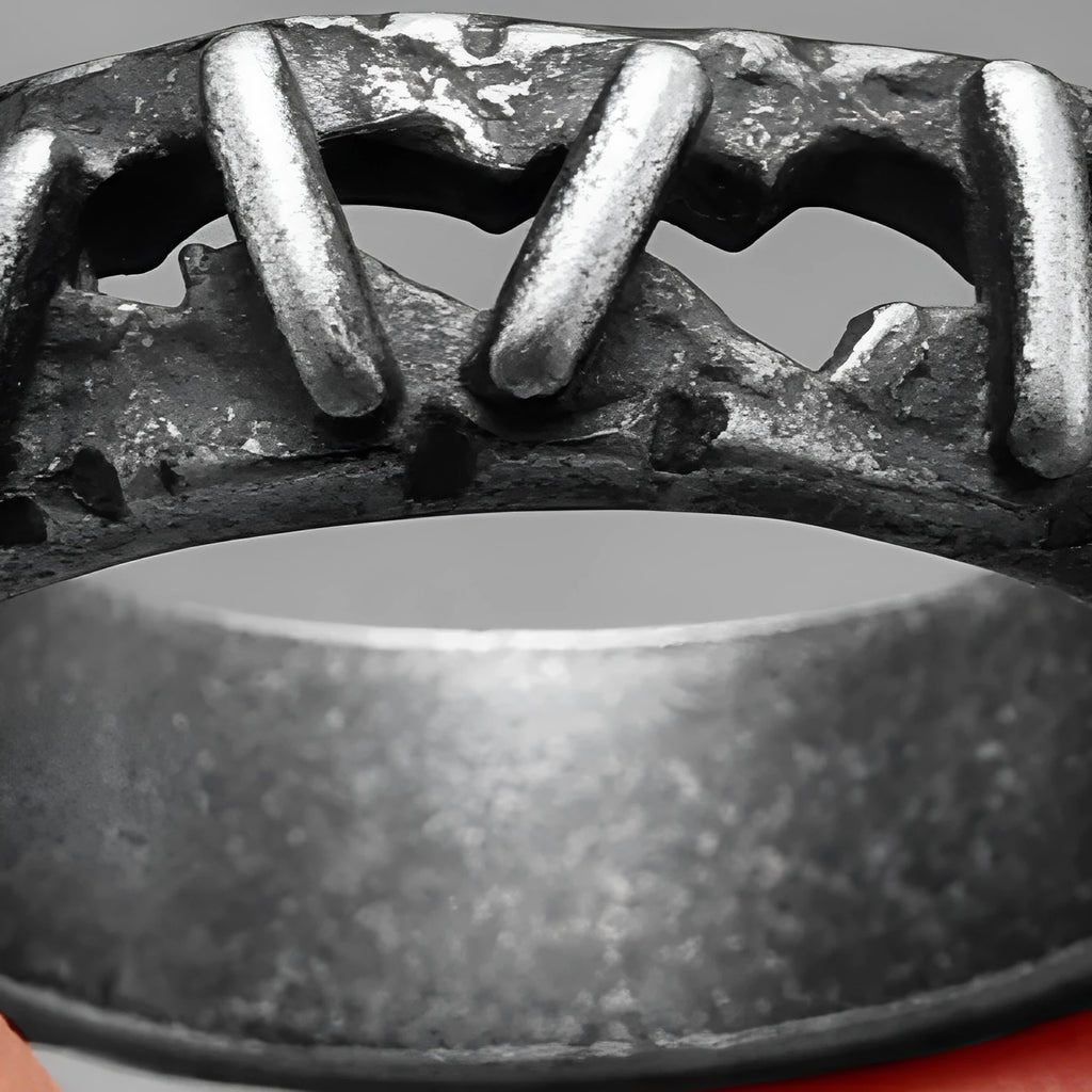 Stainless steel ring featuring dark punk stitching and a double ring design on a hand.