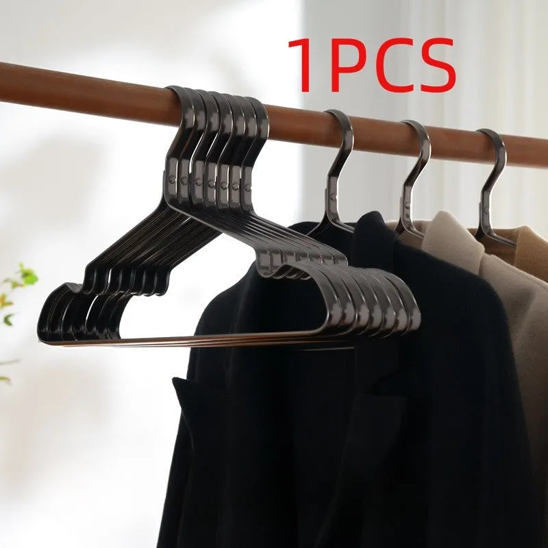Elegant black modern clothes hanger with non-slip anti-rust surface for shirts and trousers.
