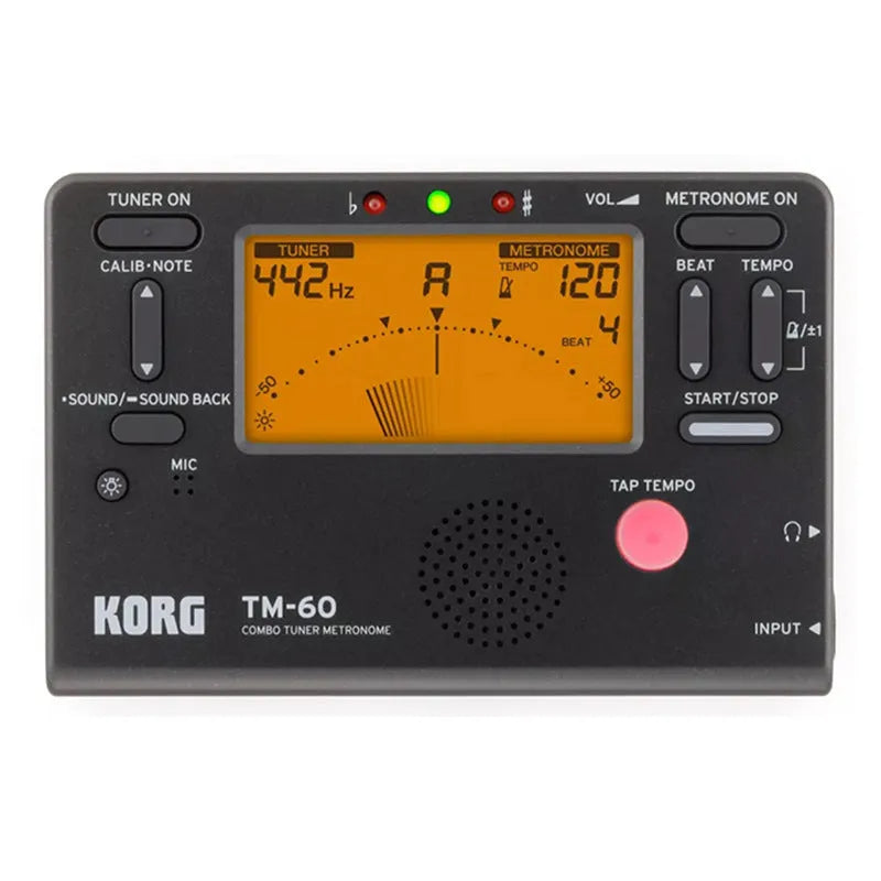 TM-60 black and white universal electronic metronome and tuner on a table.