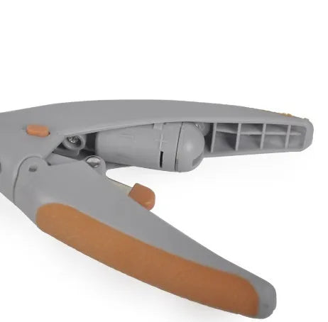 White dog nail clipper with LED light, safety guard, and three LR44 batteries on a blister card.