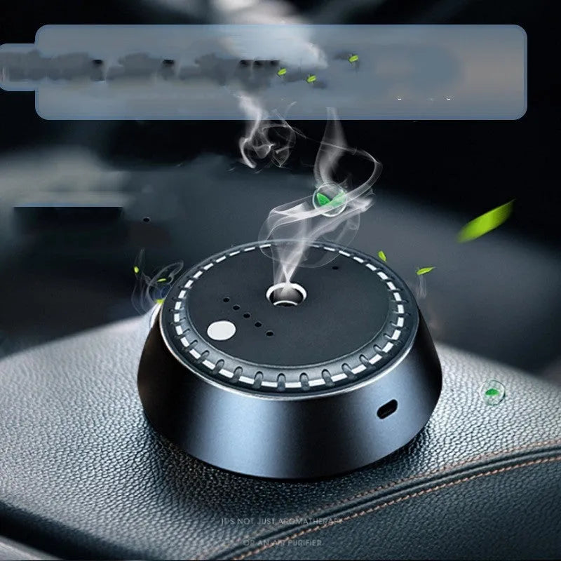 Black metal car aroma diffuser measuring 9cm by 4.5cm with USB charging port