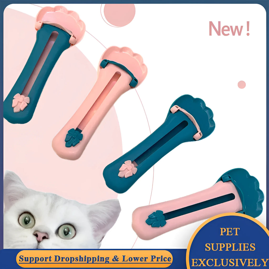 Green and pink pet food squeezer scoop dispensing a treat for a cat or dog.