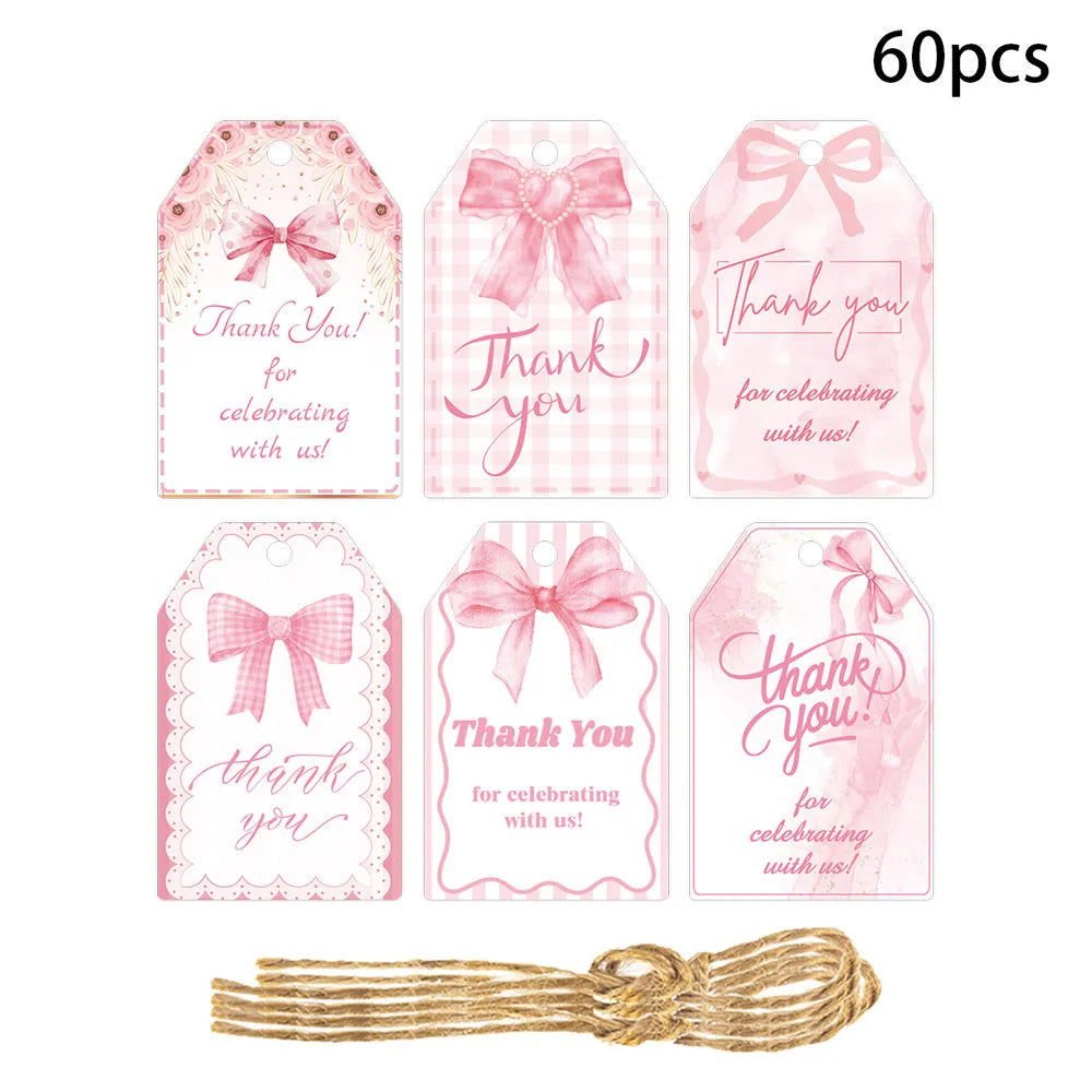 Set of 60 bowknot-shaped paper gift tags with natural hemp rope for birthday parties in three styles.