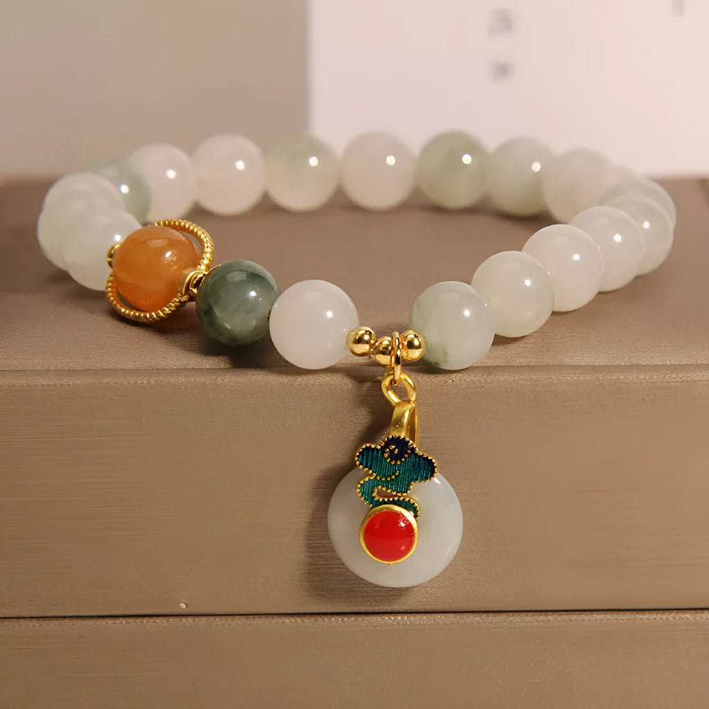 Women's genuine jade bracelet with an ice jade Xiangyun peace buckle and pearl decorative accents.