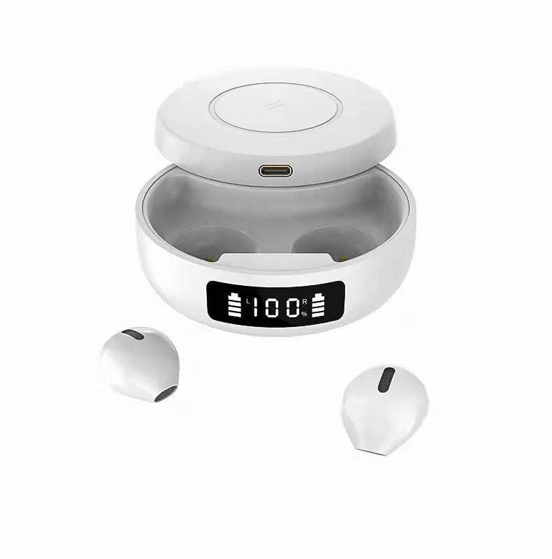 Small black semi-in-ear wireless headphones with their wireless charging case on a table.