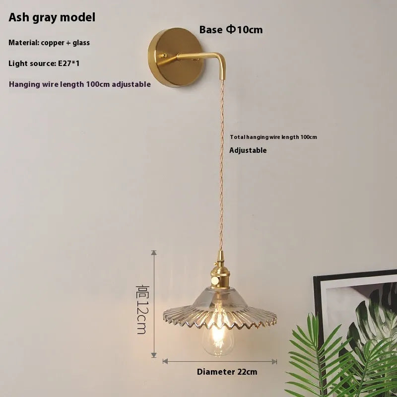Retro brass lotus wall lamp with a glass shade in a choice of six colours.
