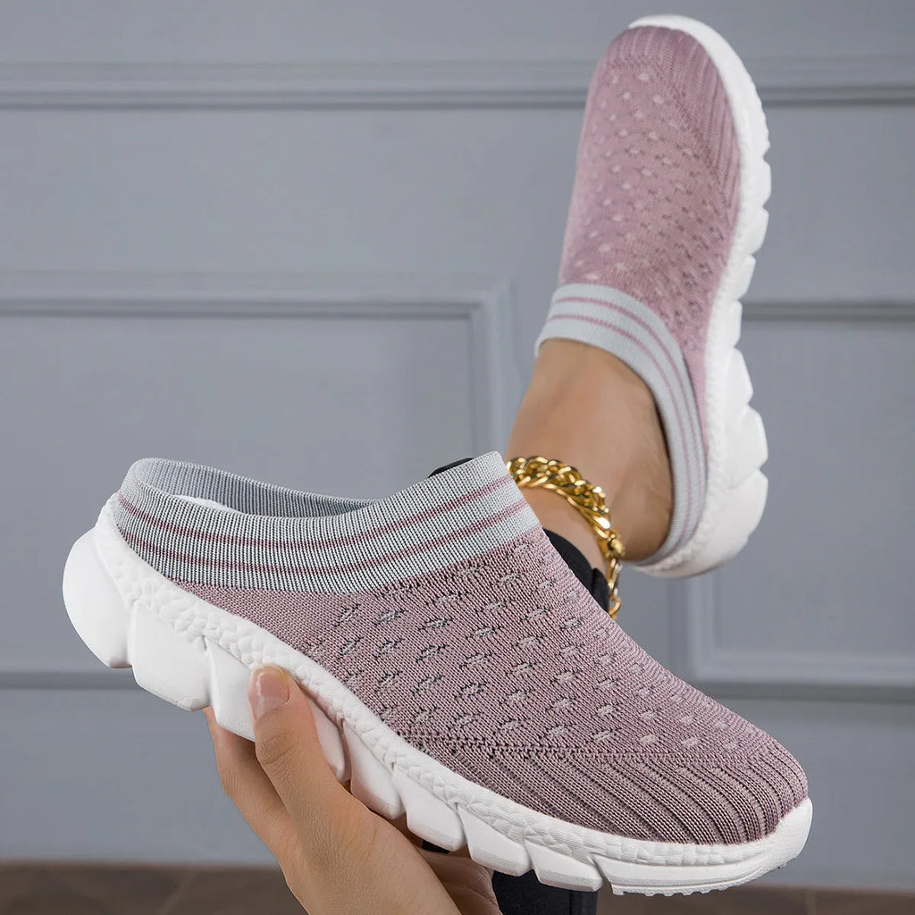 Women's black Flyknit casual shoes with striped pattern, hollowed-out design, and sewing lines on a lightweight sole.