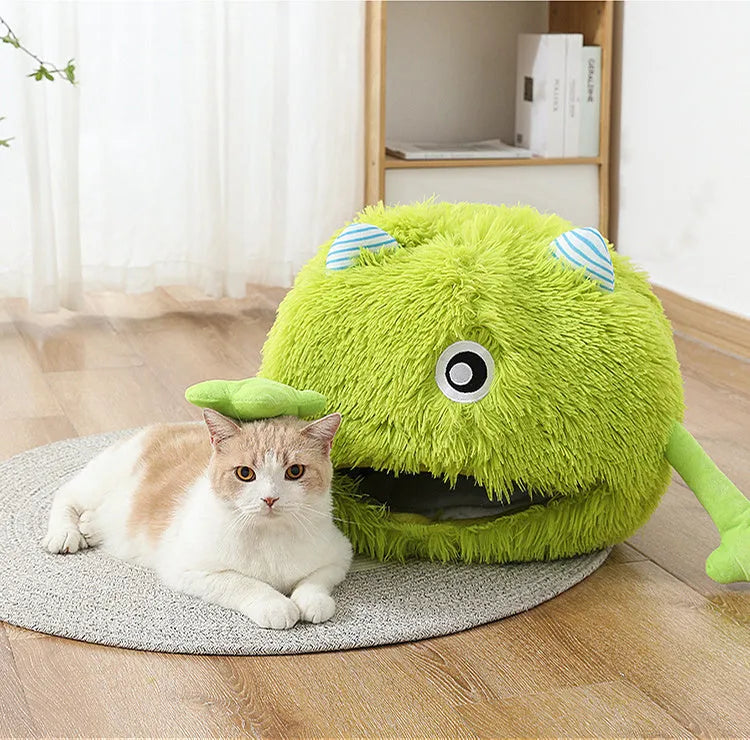 A round fluffy plush pet bed for cats and small dogs on a wooden floor.