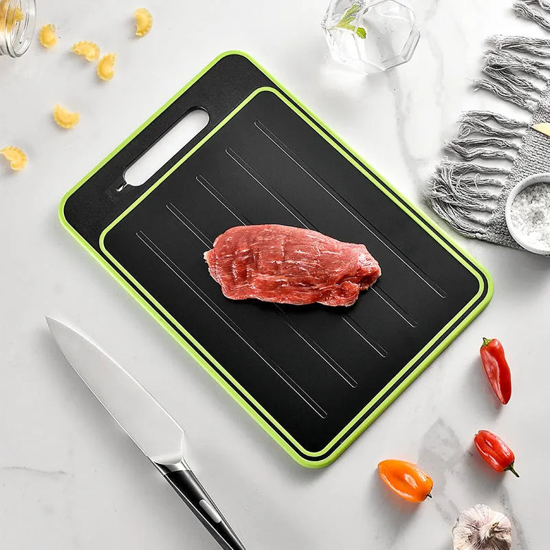 Grey square double-sided aluminium cutting board with hanging loop, defrosting surface, and built-in whetstone