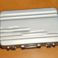 Aluminium alloy metal card holder in six colours measuring 100x65x16mm