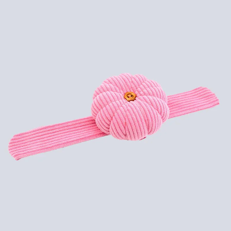Ring pincushion sewing tool with vertical cutting slot in caramel colour showing fabric cushion and metal ring base