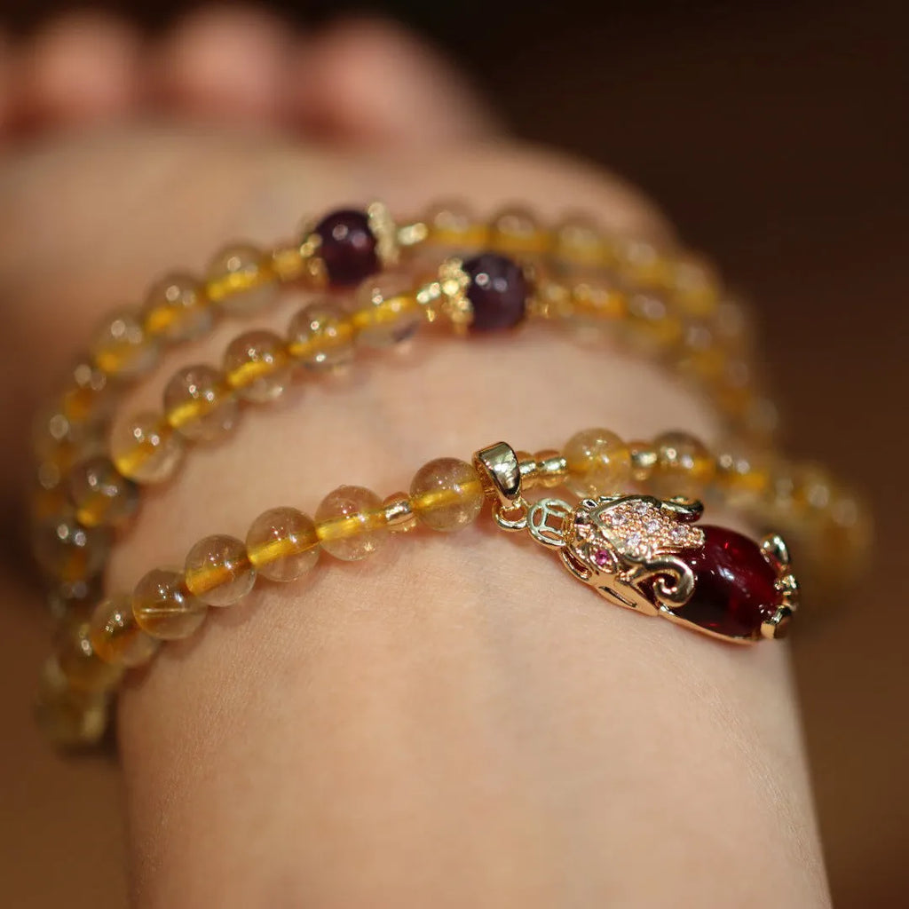 Handmade gold rutilated quartz bracelet with Chinese style hanging chopsticks and ruby quartz charm