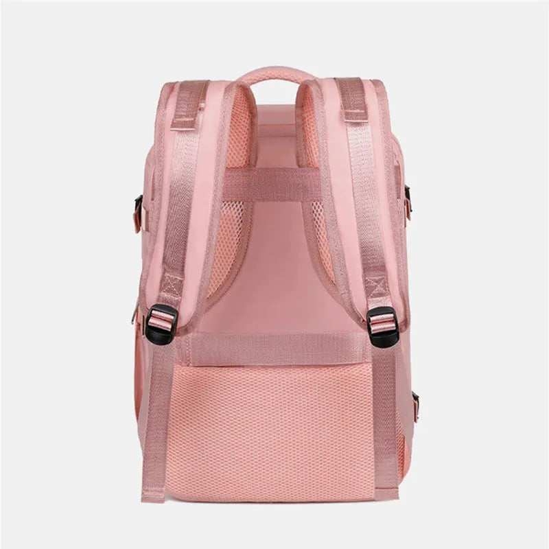 Large purple travel backpack for women with multiple compartments on a grey background.
