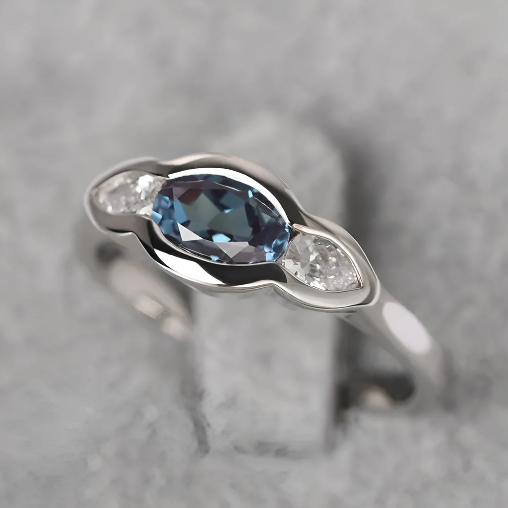 Geometric ellipse women's ring with white gold colour and inlaid zircon detailing on finger