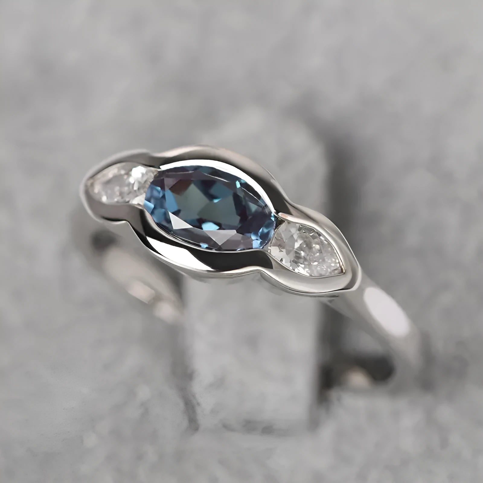 Geometric ellipse women's ring with white gold colour and inlaid zircon detailing on finger