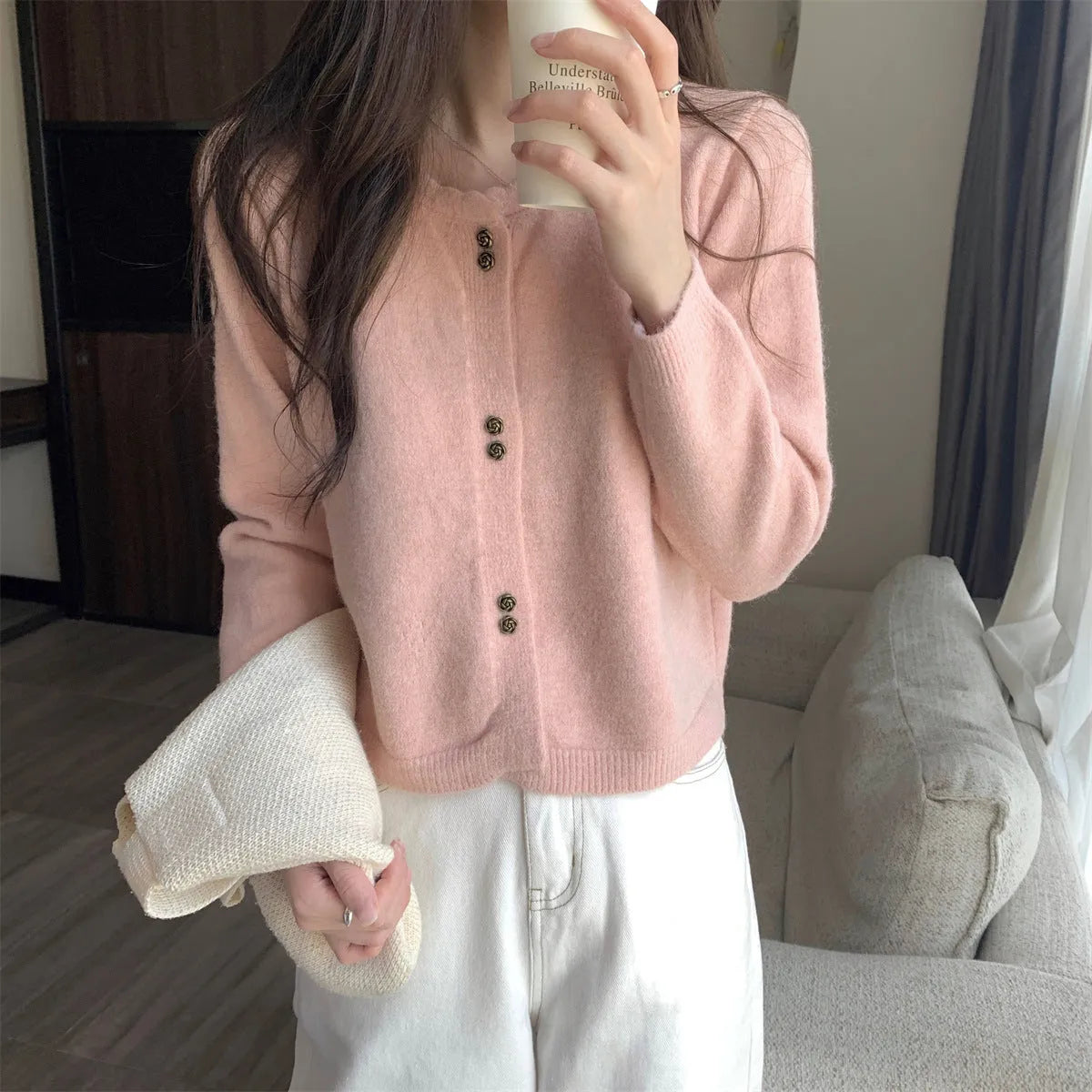 Women's milky white acrylic long-sleeve cardigan coat worn open, free size regular fit.