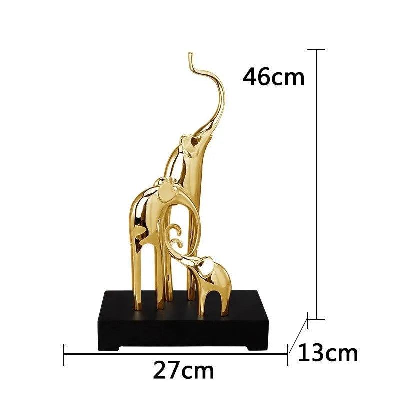 Detailed resin elephant figurine ornament in metallic gold finish on a wooden shelf.