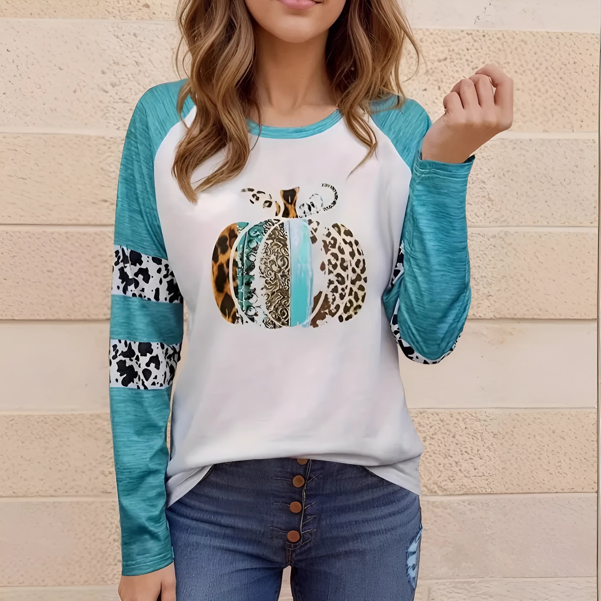 Sky blue long sleeve t-shirt with a detailed 3D printed Halloween pumpkin design on the front.