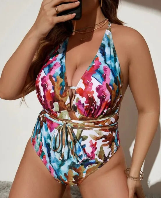 Purple solid colour women's halterneck one-piece swimsuit on a hanger