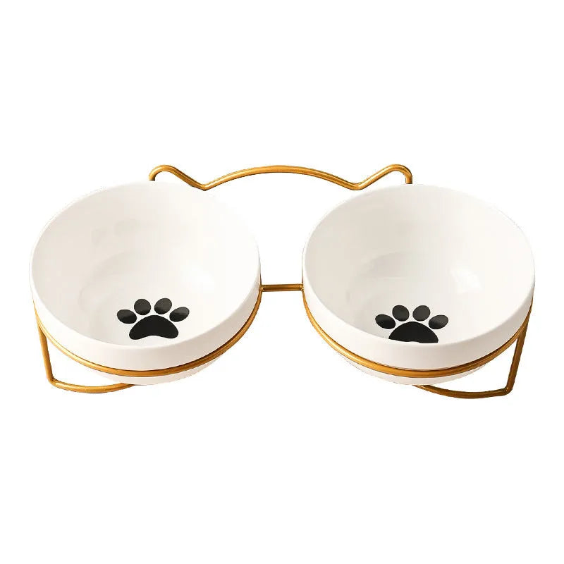 White ceramic cat bowl with decorative patterns on iron frame with cat ear details
