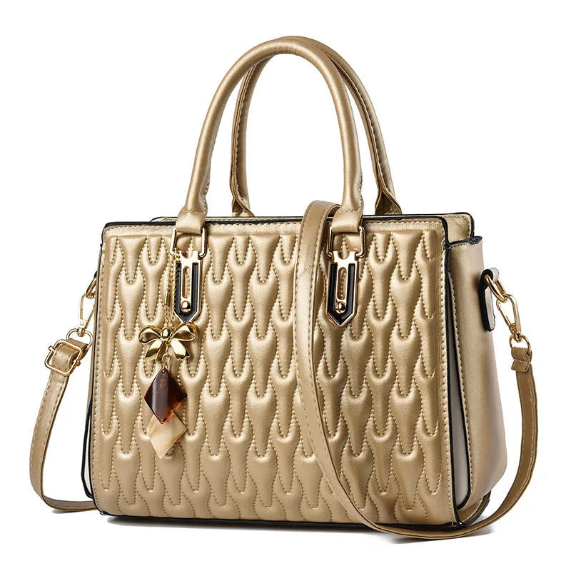 Women's messenger shoulder bag in gold colour showing outer pocket sandwich design and organised interior compartments