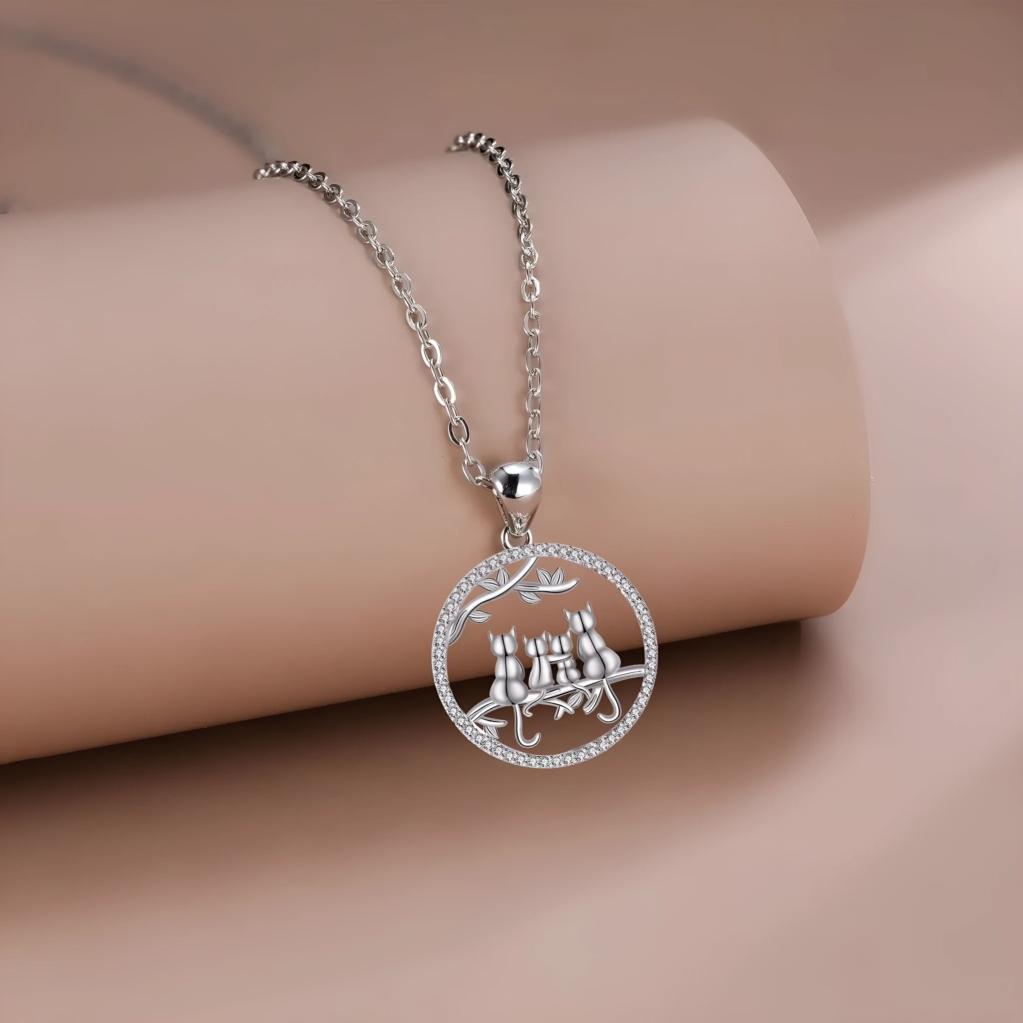 Women's silver-toned necklace with four kitten charms on cross chain