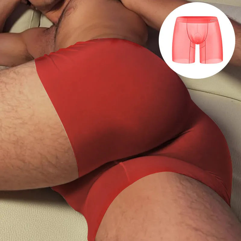 Men's orange seamless low-waist boxer shorts with quick-dry nylon fabric for exercise.