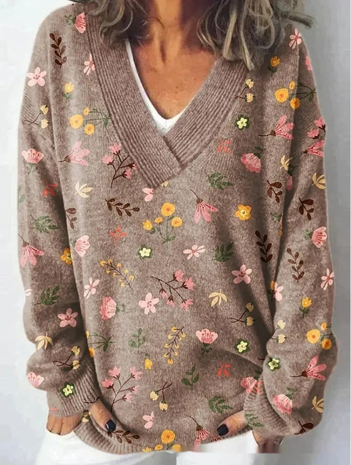 White women's V-neck long sleeve sweatshirt with a detailed 3D floral pattern print.