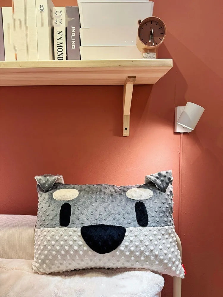 Grey Schnauzer or white West Highland Terrier themed pet pillow cushion on a sofa